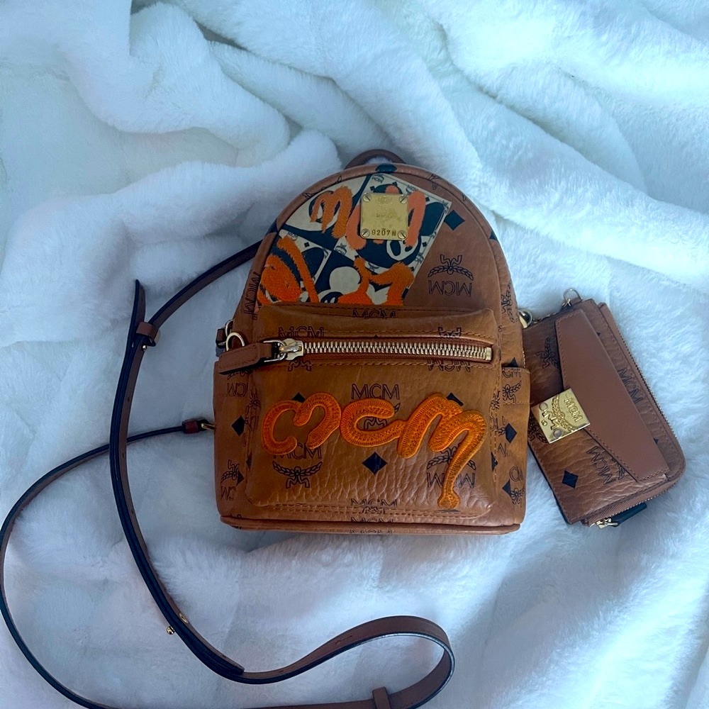 MCM small backpack/crossbody bag great condition and matching wallet.